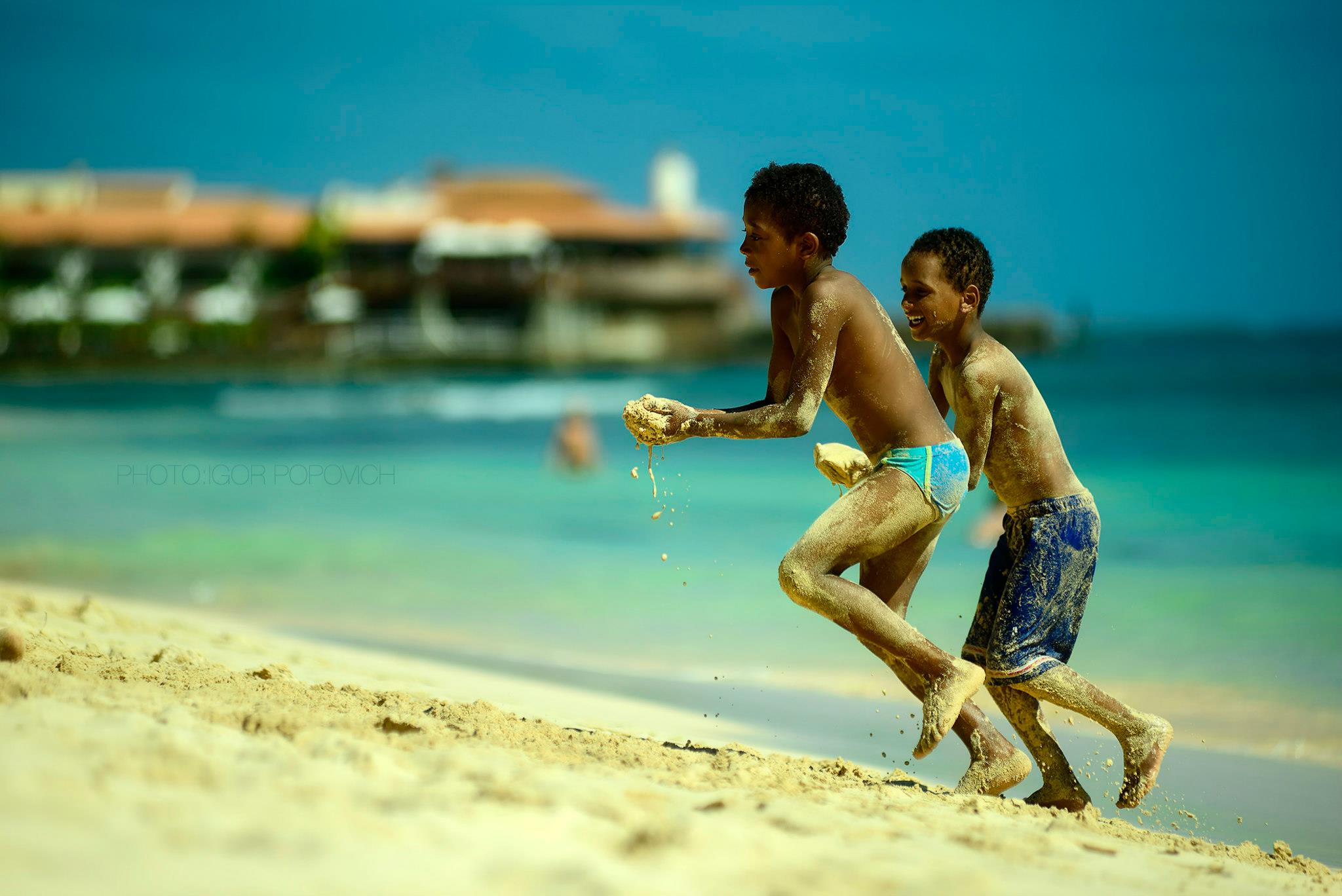 Children playing on a beach of Sal island